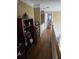 Upstairs hallway with hardwood floors, bookshelves, and nice molding at 3930 Regal Oaks Dr, Suwanee, GA 30024