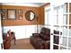 Cozy home office featuring a comfortable chair, desk, and natural light at 3930 Regal Oaks Dr, Suwanee, GA 30024