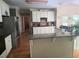 Bright kitchen with white cabinets, stainless steel appliances, granite countertops, and hardwood floors at 3930 Regal Oaks Dr, Suwanee, GA 30024
