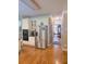 Spacious kitchen with stainless refrigerator, white cabinets, hardwood floors at 3930 Regal Oaks Dr, Suwanee, GA 30024