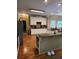 Spacious kitchen with stainless appliances, white cabinets, and granite counters at 3930 Regal Oaks Dr, Suwanee, GA 30024