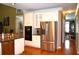 Bright kitchen featuring stainless steel appliances, granite countertops, and hardwood floors at 3930 Regal Oaks Dr, Suwanee, GA 30024