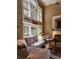 Open-concept living room with lots of natural light and fireplace at 3930 Regal Oaks Dr, Suwanee, GA 30024