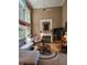 Bright living room with high ceilings, fireplace, and oversized windows at 3930 Regal Oaks Dr, Suwanee, GA 30024