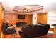 Cozy basement living room with comfortable seating, TV, and recessed lighting at 3930 Regal Oaks Dr, Suwanee, GA 30024
