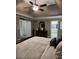 Bedroom featuring a bed, nightstand and an attached bathroom at 3930 Regal Oaks Dr, Suwanee, GA 30024
