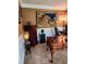 Office space boasts a large tapestry, detailed wood desk, carpeted floors, and a dark filing cabinet at 3930 Regal Oaks Dr, Suwanee, GA 30024