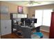 Home office with a large desk, a ceiling fan, and modern decor at 3930 Regal Oaks Dr, Suwanee, GA 30024
