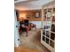 Home office features carpeted floors, French doors, a desk, and dark furniture at 3930 Regal Oaks Dr, Suwanee, GA 30024