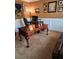 Comfortable office with dark furniture, carpeted floors, wainscoting, and a tapestry at 3930 Regal Oaks Dr, Suwanee, GA 30024