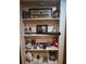 Detailed view of shelves displaying sports memorabilia and decorative items, adding character to the home at 3930 Regal Oaks Dr, Suwanee, GA 30024