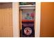 Finished basement closet featuring organized shelving and sports memorabilia at 3930 Regal Oaks Dr, Suwanee, GA 30024