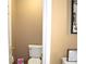 Small toilet room with a toilet and a wall art at 3930 Regal Oaks Dr, Suwanee, GA 30024