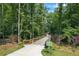 Scenic walking trail through lush greenery, offering a serene and accessible outdoor experience for residents at 3930 Regal Oaks Dr, Suwanee, GA 30024