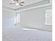 A spacious bedroom features tray ceilings and large windows at 1436 Weeping Tree Dr, Auburn, GA 30011