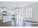Bright kitchen features stainless appliances, granite countertops, and an eat-in area at 1436 Weeping Tree Dr, Auburn, GA 30011