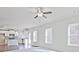 Well-lit living room with open layout to kitchen with stainless appliances, ideal for entertaining and modern living at 1436 Weeping Tree Dr, Auburn, GA 30011