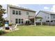 Oversized backyard featuring lush greenery, a patio, and outdoor seating, creating a relaxing outdoor oasis at 2099 Lakeview Bend Way, Buford, GA 30519