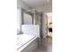 Bright bathroom featuring a soaking tub, glass shower, and stylish gray tile at 2099 Lakeview Bend Way, Buford, GA 30519