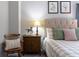 Cozy bedroom showcasing neutral tones, a comfortable bed, and charming decorative accents at 2099 Lakeview Bend Way, Buford, GA 30519