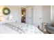Well-lit bedroom with a comfortable bed, decorative pillows, and light-toned walls at 2099 Lakeview Bend Way, Buford, GA 30519