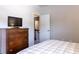 Bedroom showcasing a comfortable bed and an antique dresser at 2099 Lakeview Bend Way, Buford, GA 30519