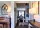 Elegant foyer with hardwood floors, decorative accents, and a view into the dining room at 2099 Lakeview Bend Way, Buford, GA 30519