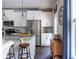 Stylish kitchen featuring white cabinets, granite countertops, stainless steel appliances, and dark hardwood floors at 2099 Lakeview Bend Way, Buford, GA 30519