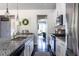Modern kitchen with granite island, stainless steel appliances, and open access to the rest of the home at 2099 Lakeview Bend Way, Buford, GA 30519