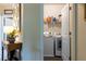 Bright laundry room with modern washer, dryer, and wire shelving for plenty of storage at 2099 Lakeview Bend Way, Buford, GA 30519
