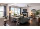 Open-concept living room with ample natural light, comfortable seating, and seamless flow to other areas of the house at 2099 Lakeview Bend Way, Buford, GA 30519