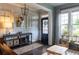 Cozy living room featuring elegant decor, hardwood floors, and plenty of natural light at 2099 Lakeview Bend Way, Buford, GA 30519