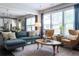 Bright living room boasts a large window, open layout, comfortable sofa, and stylish decor for a modern feel at 2099 Lakeview Bend Way, Buford, GA 30519