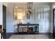 Inviting living room with hardwood floors, decorative console table, and ample natural light at 2099 Lakeview Bend Way, Buford, GA 30519