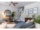 Inviting living room features a ceiling fan, staircase, and comfortable seating arrangement for a relaxing atmosphere at 2099 Lakeview Bend Way, Buford, GA 30519