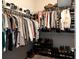 Spacious walk-in closet with ample hanging space and shelving for organized storage at 2099 Lakeview Bend Way, Buford, GA 30519