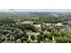 Aerial view showing the home's location relative to nearby businesses, buildings, and cityscape at 3581 Ridge Se Rd, Smyrna, GA 30080