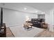 Open concept finished basement with seating, a dining area, and wood-look flooring at 3581 Ridge Se Rd, Smyrna, GA 30080