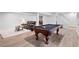 Spacious basement featuring a pool table, comfortable seating, and modern flooring at 3581 Ridge Se Rd, Smyrna, GA 30080