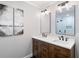 Modern bathroom featuring a double sink vanity, mirrors and black hardware at 3581 Ridge Se Rd, Smyrna, GA 30080