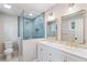 Beautiful bathroom boasts a glass shower, double vanity, and framed mirrors at 3581 Ridge Se Rd, Smyrna, GA 30080