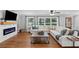 Comfortable living room with large windows, modern fireplace, and stylish furnishings at 3581 Ridge Se Rd, Smyrna, GA 30080