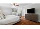 Spacious main bedroom featuring a dresser with a TV, providing a relaxing retreat at 3581 Ridge Se Rd, Smyrna, GA 30080