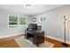 Office space with hardwood floors, neutral paint, a black desk, and ample natural light from two windows at 3581 Ridge Se Rd, Smyrna, GA 30080