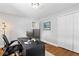 Office space with hardwood floors, neutral paint, a black desk, a closet, and ample natural light from a window at 3581 Ridge Se Rd, Smyrna, GA 30080