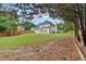 Spacious backyard with mature trees and grass at 3957 Marquette Nw Way, Kennesaw, GA 30144