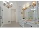 Spacious bathroom boasts a soaking tub, glass shower, double vanities, and bright, neutral color scheme at 3957 Marquette Nw Way, Kennesaw, GA 30144