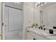 Elegant bathroom with white vanity, dark fixtures and a shower at 3957 Marquette Nw Way, Kennesaw, GA 30144