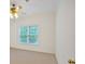 Relaxing bedroom featuring a window, ceiling fan, and neutral walls, creating a serene and inviting atmosphere at 3957 Marquette Nw Way, Kennesaw, GA 30144