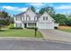 Traditional two-story home with a manicured lawn, a two-car garage, and complementary landscaping at 3957 Marquette Nw Way, Kennesaw, GA 30144